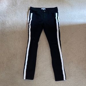 Black Fashion Nova Jeans with white stripes.